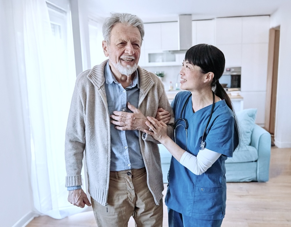 Male senior being assisted by a nurse